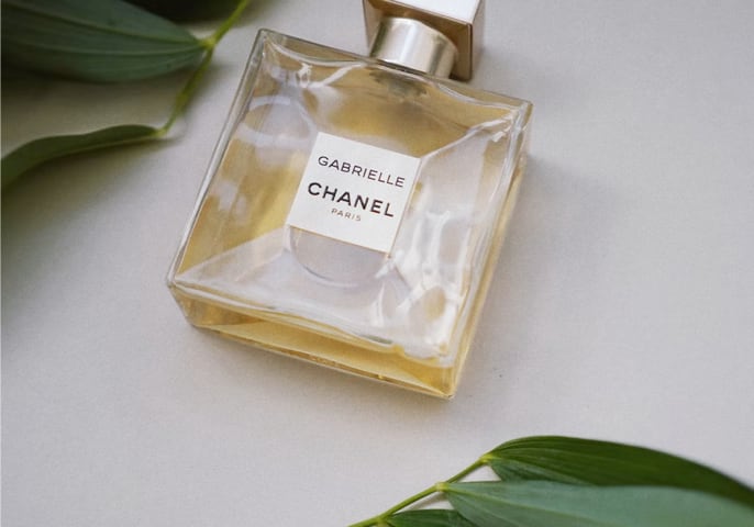 Chanel parfum bottle with some flowers